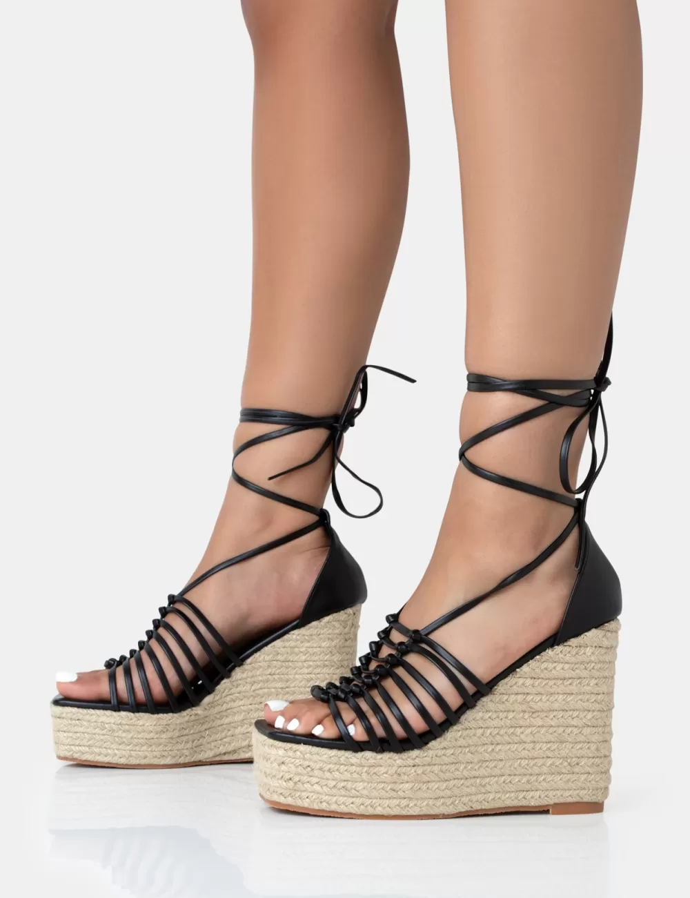 Shop Public Desire Reece PU Knot Strap Lace Up Raffia Wedge Heels Black