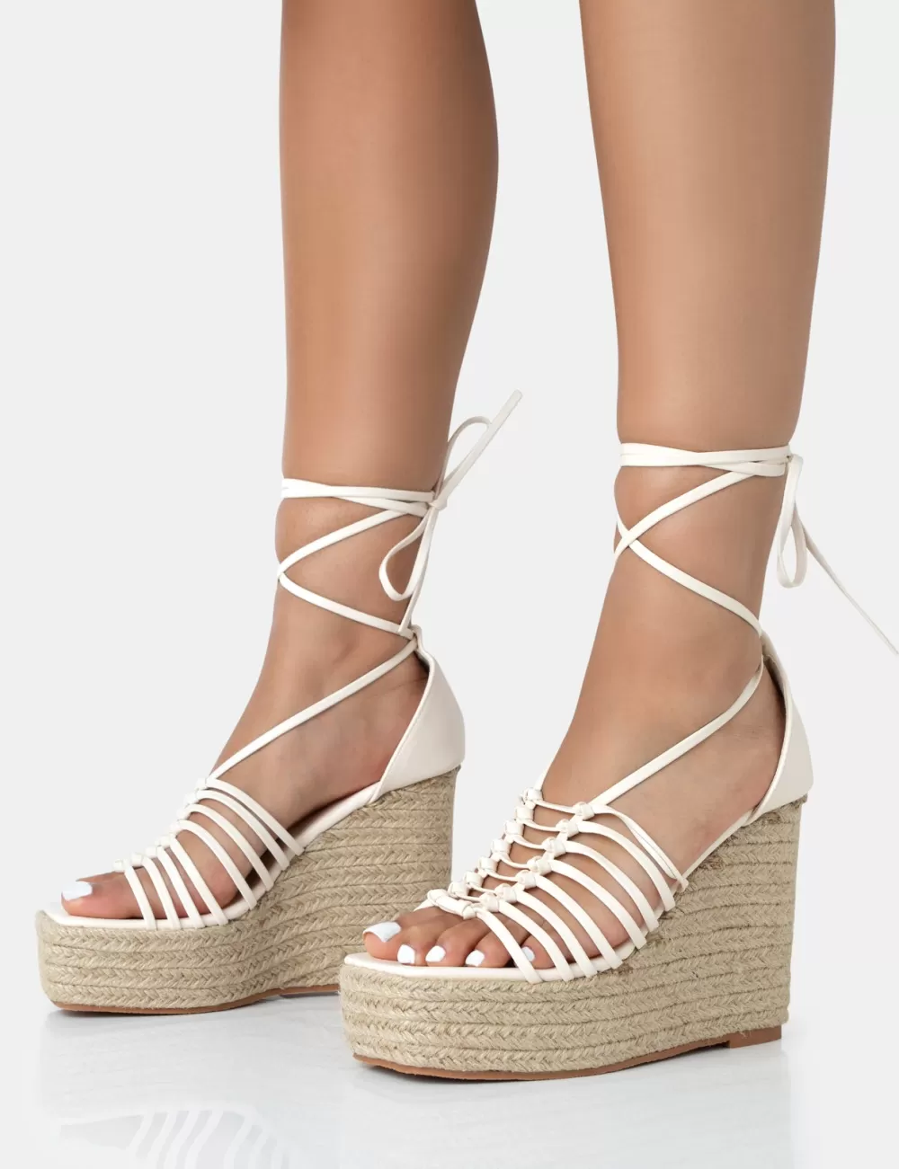Shop Public Desire Reece Wide Fit Ecru Pu Knot Strap Lace Up Raffia Wedge Heels Neutral